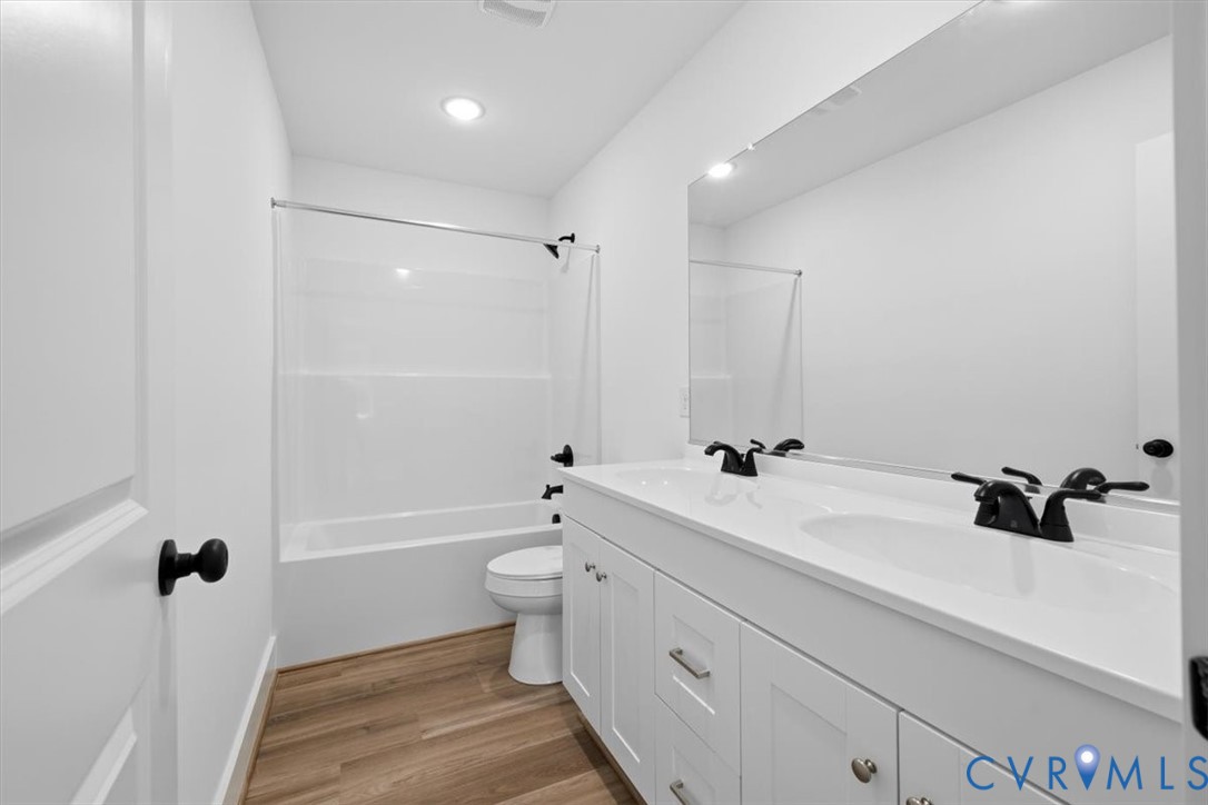 654 Frenchs Store Road Cumberland, VA 23040 - Photo 15 of 24 Bathroom featuring a dual sink vanity with white c
