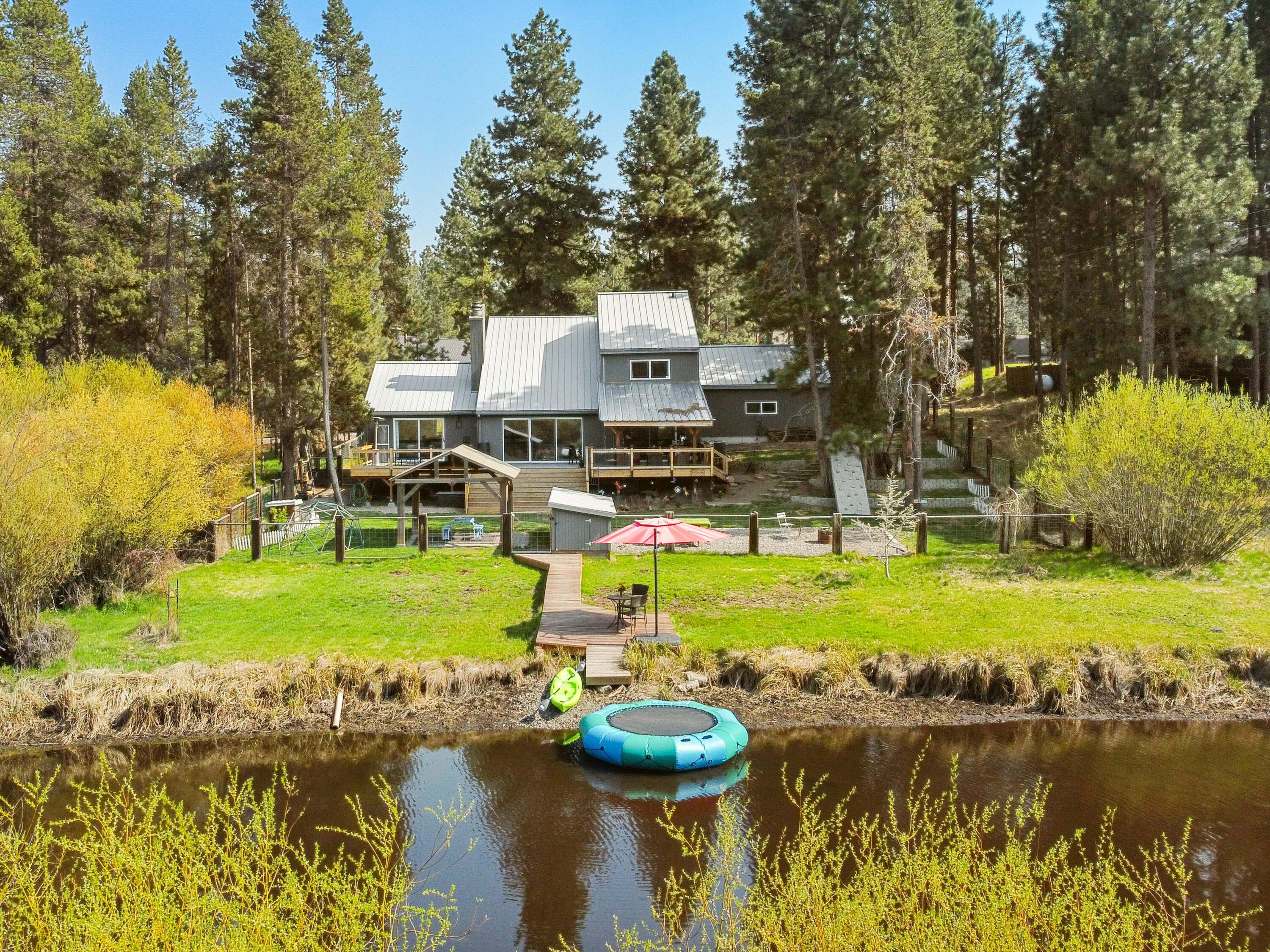 17062 Milky Way Bend, OR 97707 - Photo 1 of 39 Riverfront chalet on a private bend of the Deschutes within the Central Oregon pine forest