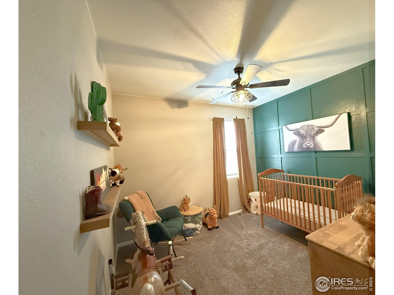 1780 Floret Drive Windsor, CO 80550 - Photo 22 of 36 a living room with a couch