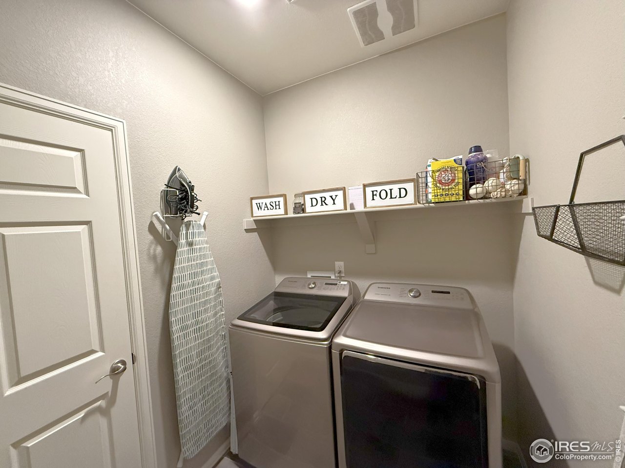 1780 Floret Drive Windsor, CO 80550 - Photo 26 of 36 a utility room with dryer and washer