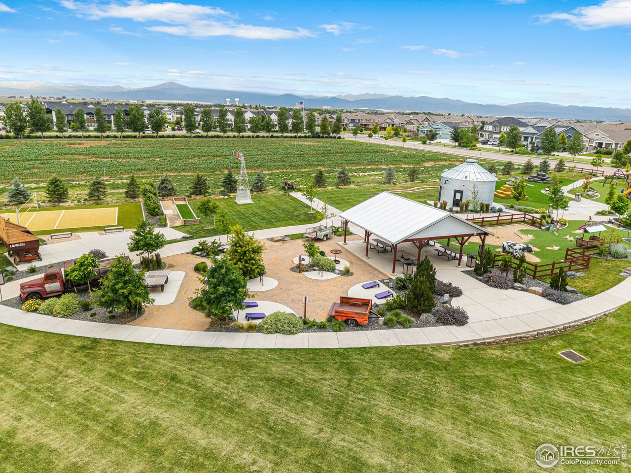 1780 Floret Drive Windsor, CO 80550 - Photo 32 of 36 a view of a swimming pool with an outdoor seating