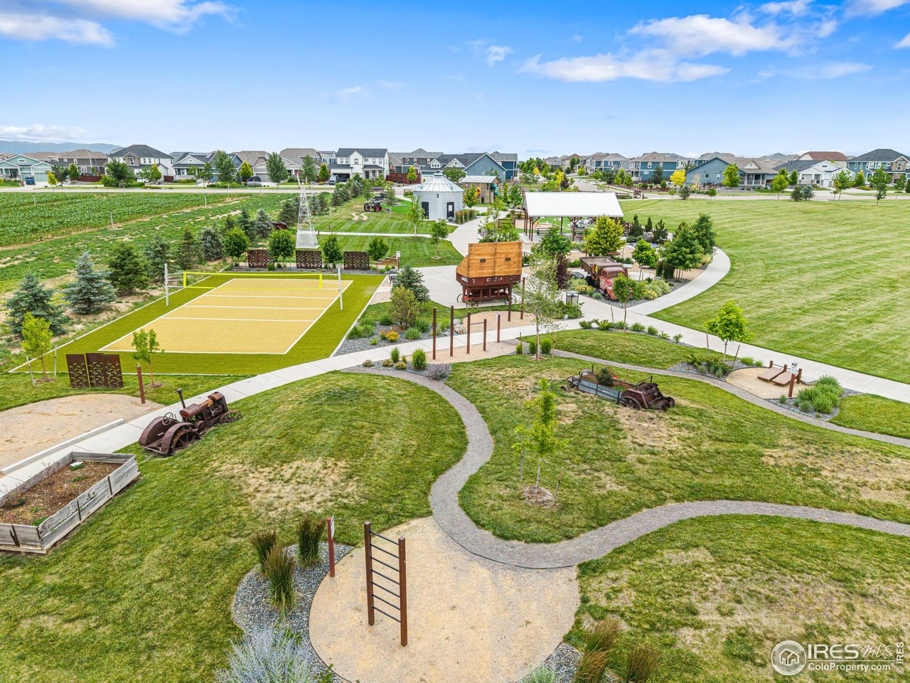 1780 Floret Drive Windsor, CO 80550 - Photo 33 of 36 a view of a swimming pool and lake view