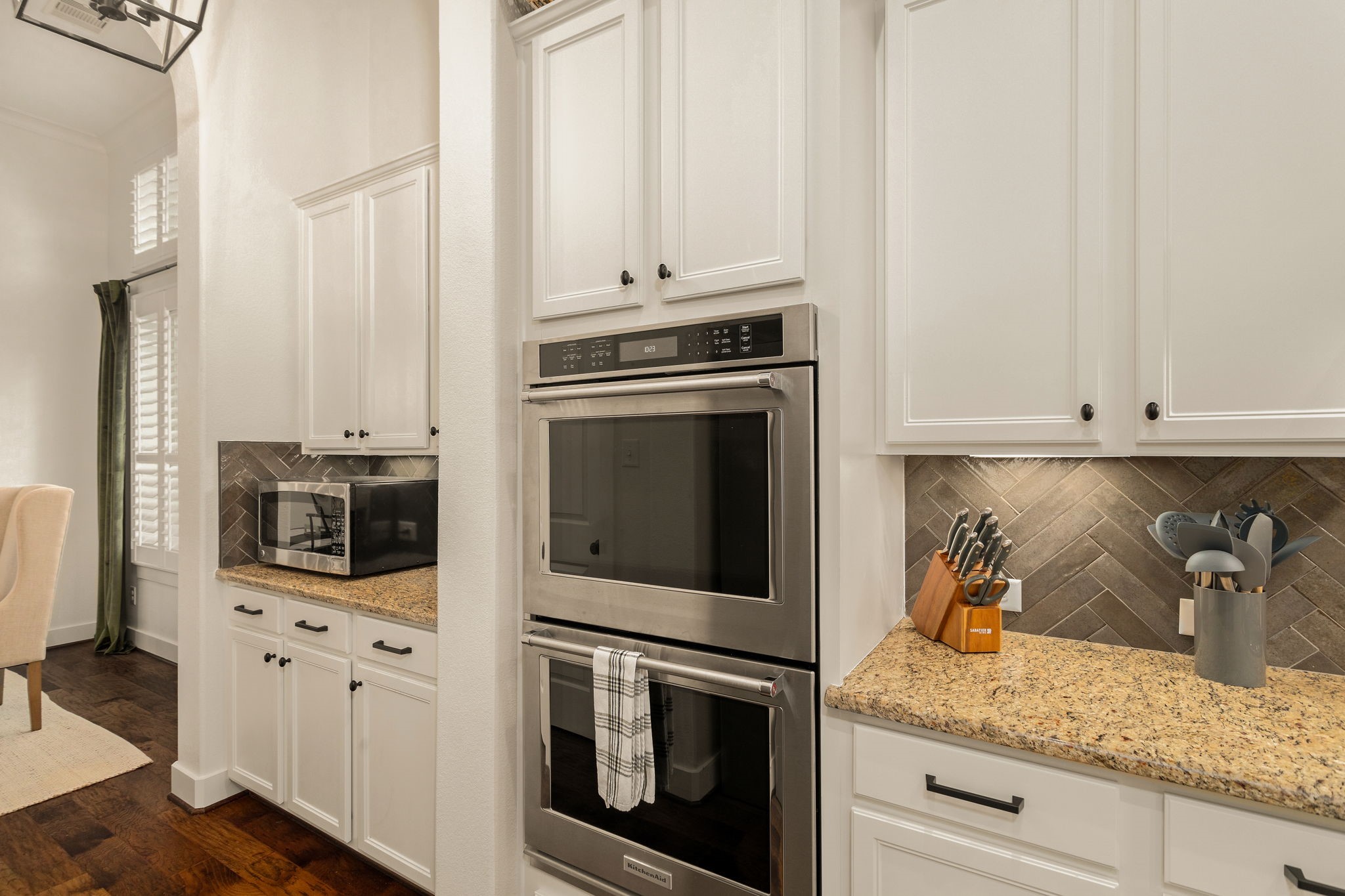 16650 Seminole Ridge Drive Cypress, TX 77433 - Photo 6 of 27 a kitchen with granite countertop white cabinets and stainless steel appliances