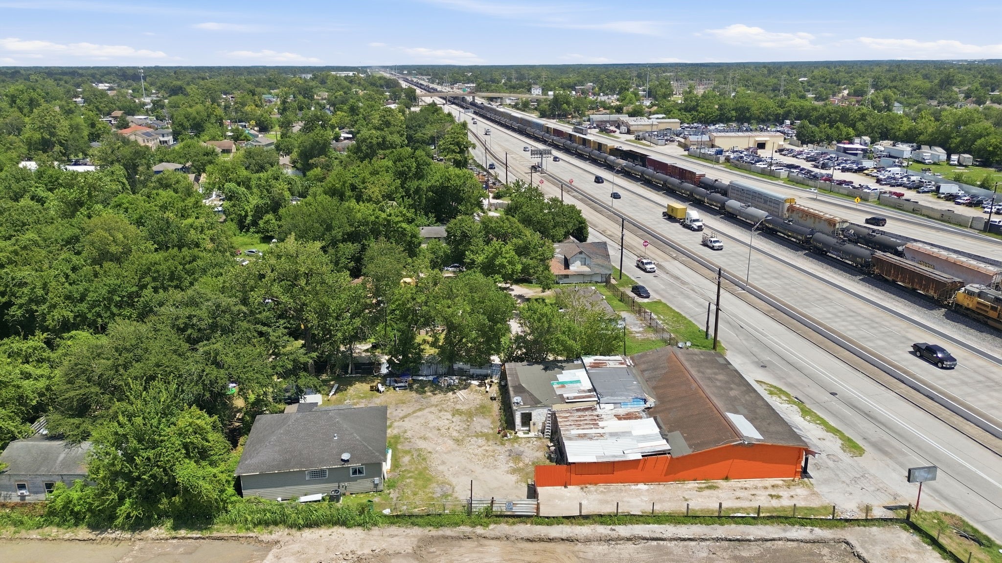 7715 West Hardy Road Houston, TX 77022 - Photo 14 of 19 Prime location with easy highway access and potential for commercial or residential development. Surrounded by lush greenery, this expansive property offers both convenience and seclusion.