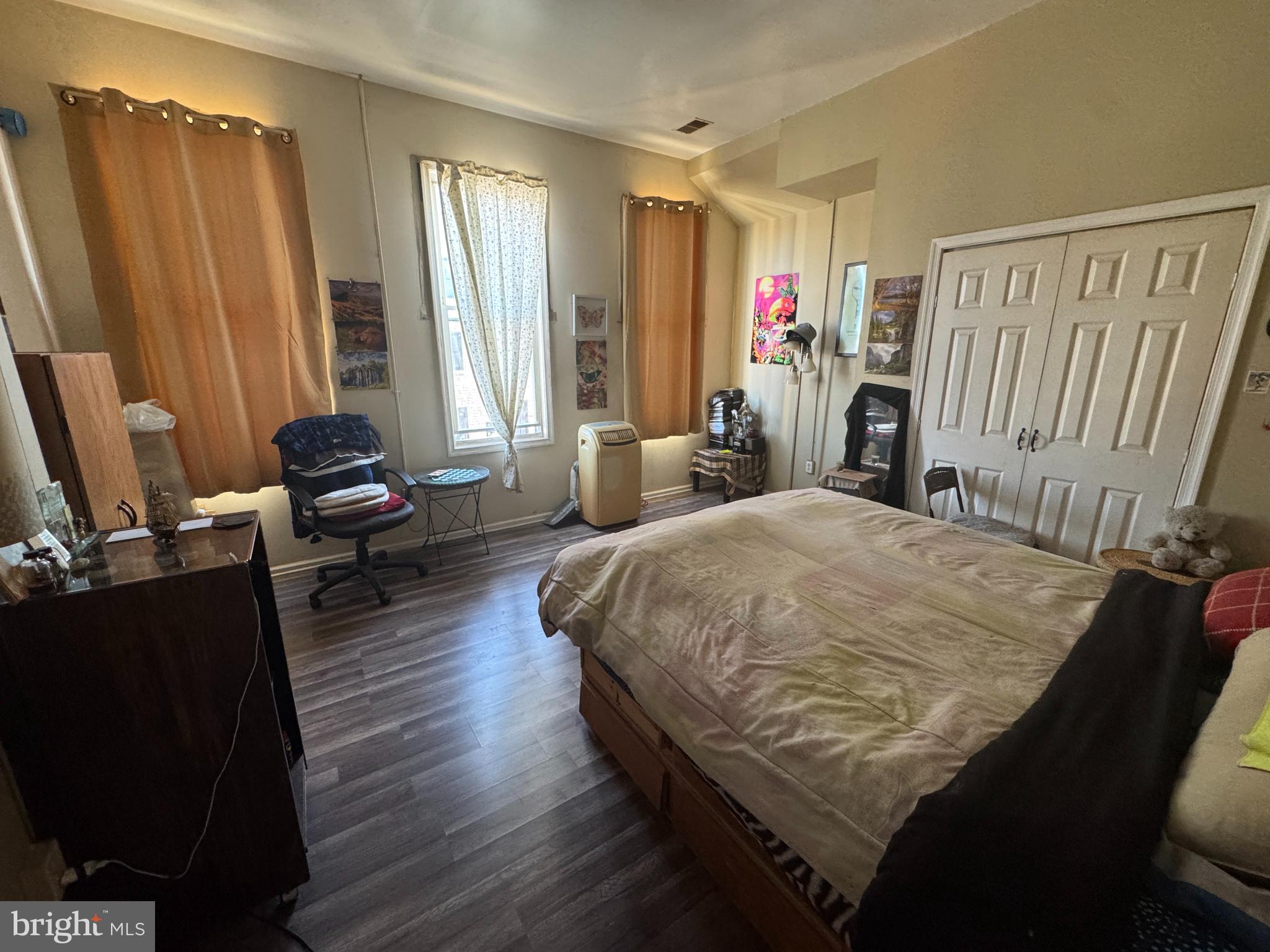 1736 McCulloh Street Baltimore, MD 21217 - Photo 6 of 14 a bed sitting in a bedroom next to a window