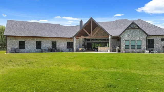 a front view of house with yard and green space