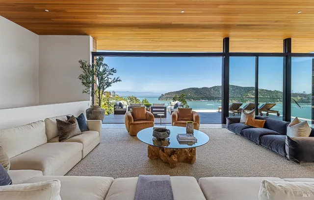 a roof deck with table and chairs