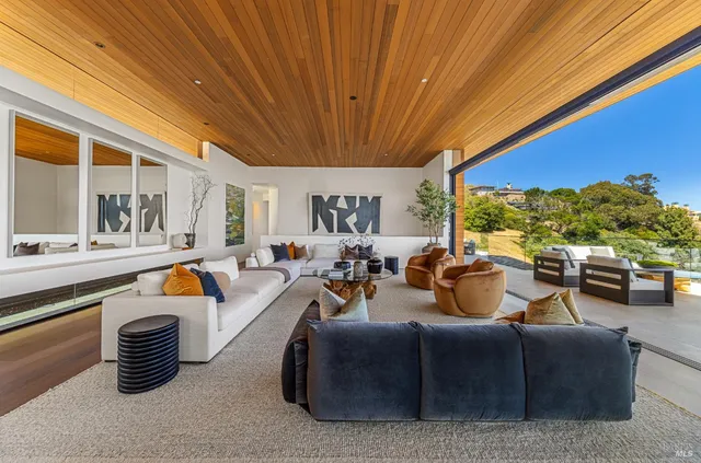 a spacious bedroom with a bed and a large window