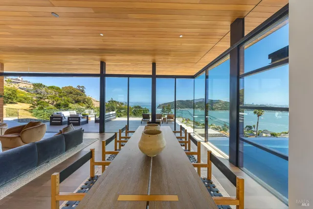 a bed room with a bed and a painting on the wall