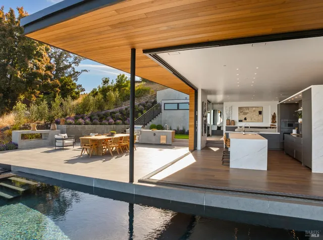 a view of a swimming pool with outdoor seating