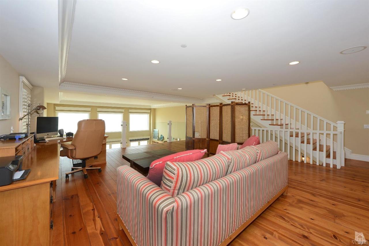 1081 Mandalay Beach Road Oxnard, CA 93035 - Photo 22 of 42 a living room with furniture and wooden floor