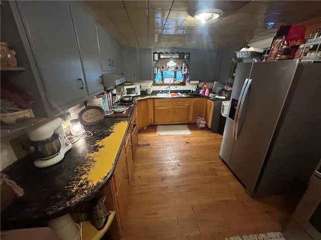 a bathroom with a toilet and a mirror