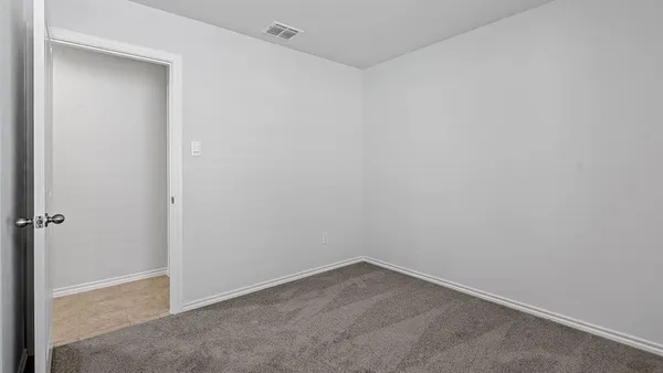 a bathroom with a granite countertop toilet and a shower