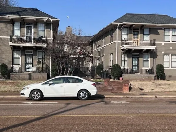 a car parked in front of a building