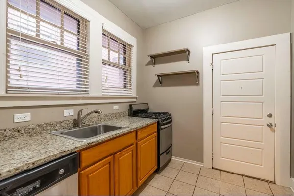 a kitchen with a sink and cabinets
