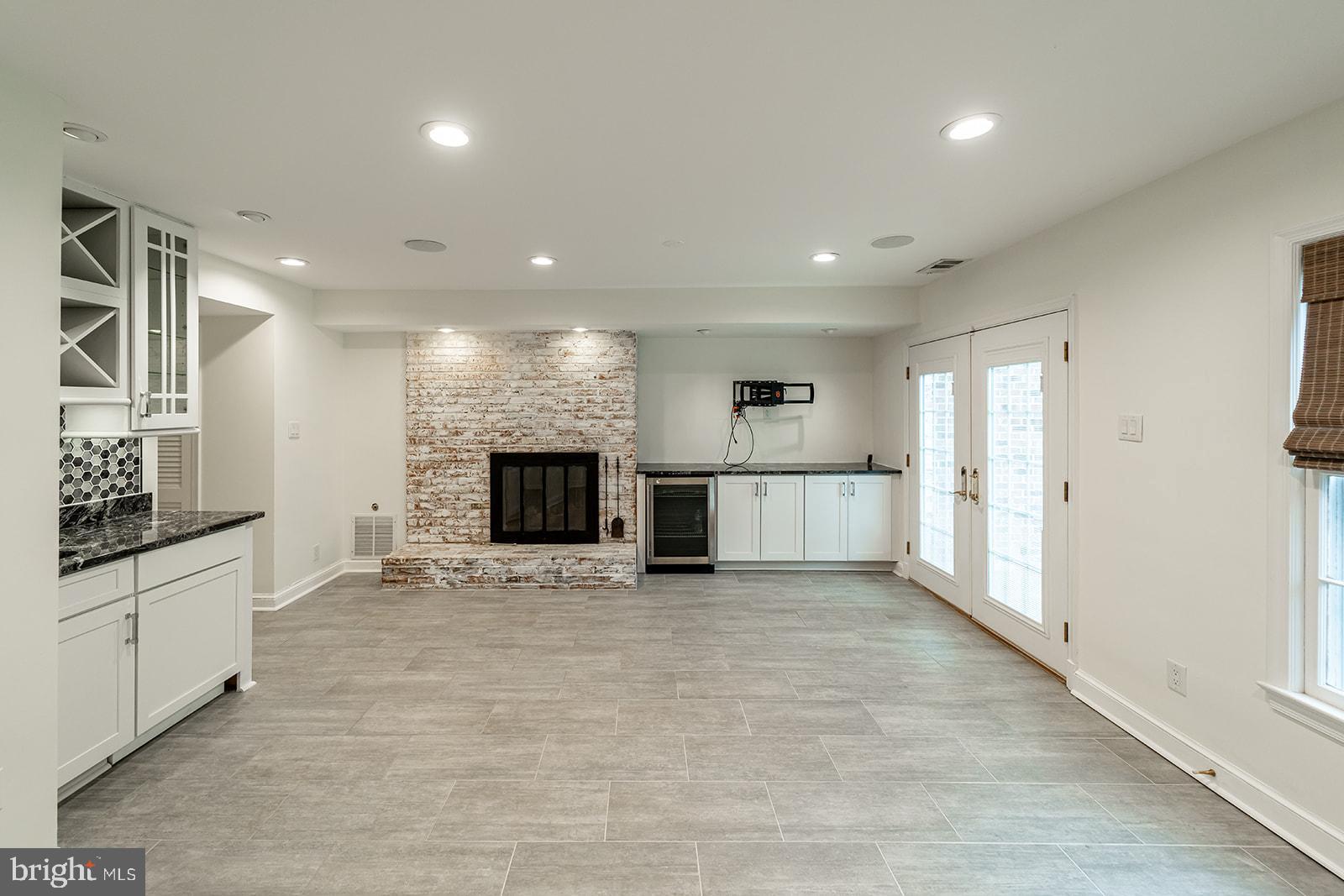 1734 Olde Towne Road Alexandria, VA 22307 - Photo 17 of 36 Lower Level Rec Room w/ Beverage Fridge and Firepl