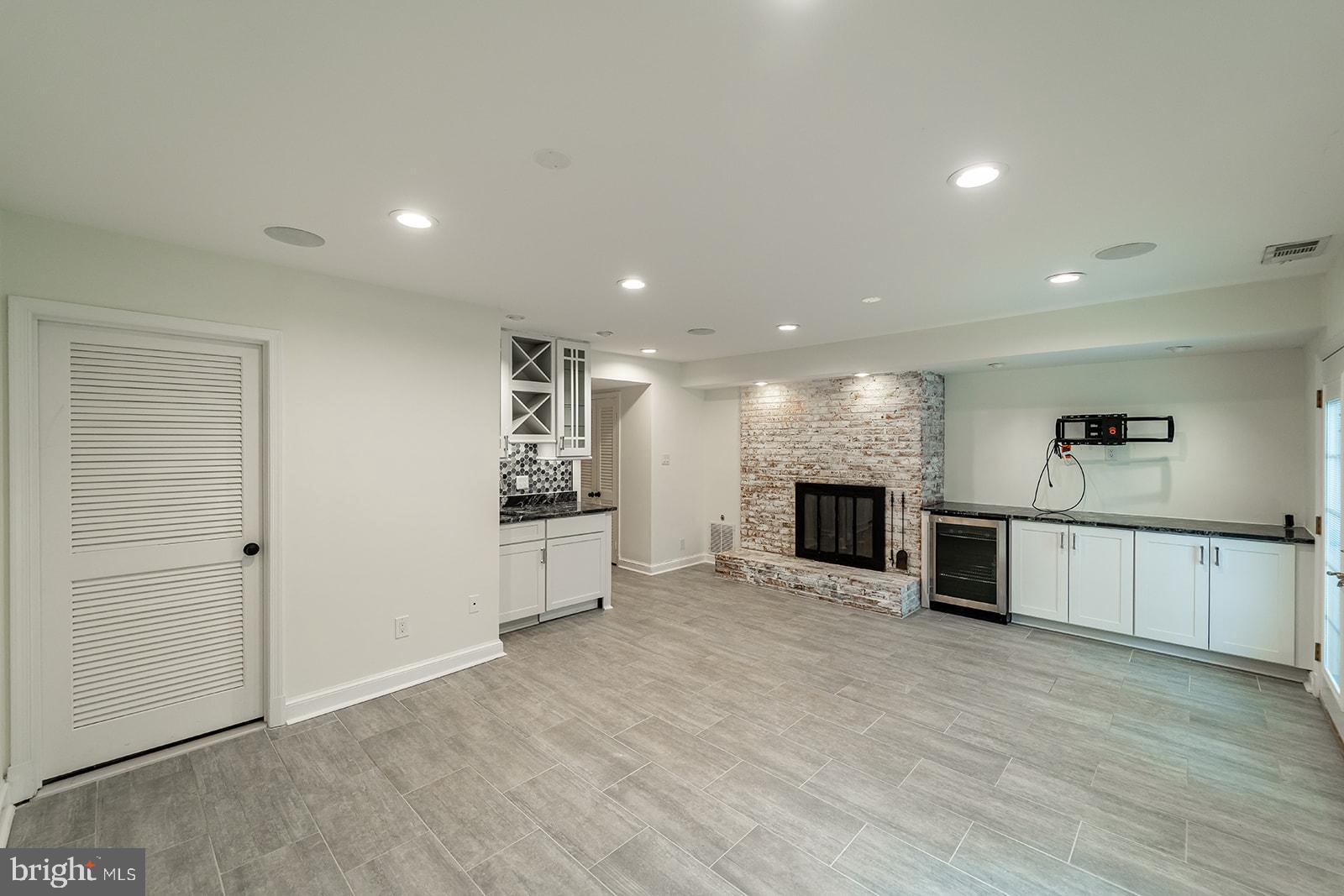 1734 Olde Towne Road Alexandria, VA 22307 - Photo 19 of 36 Lower Level Rec Room w/ Gas Fireplace and Wet Bar