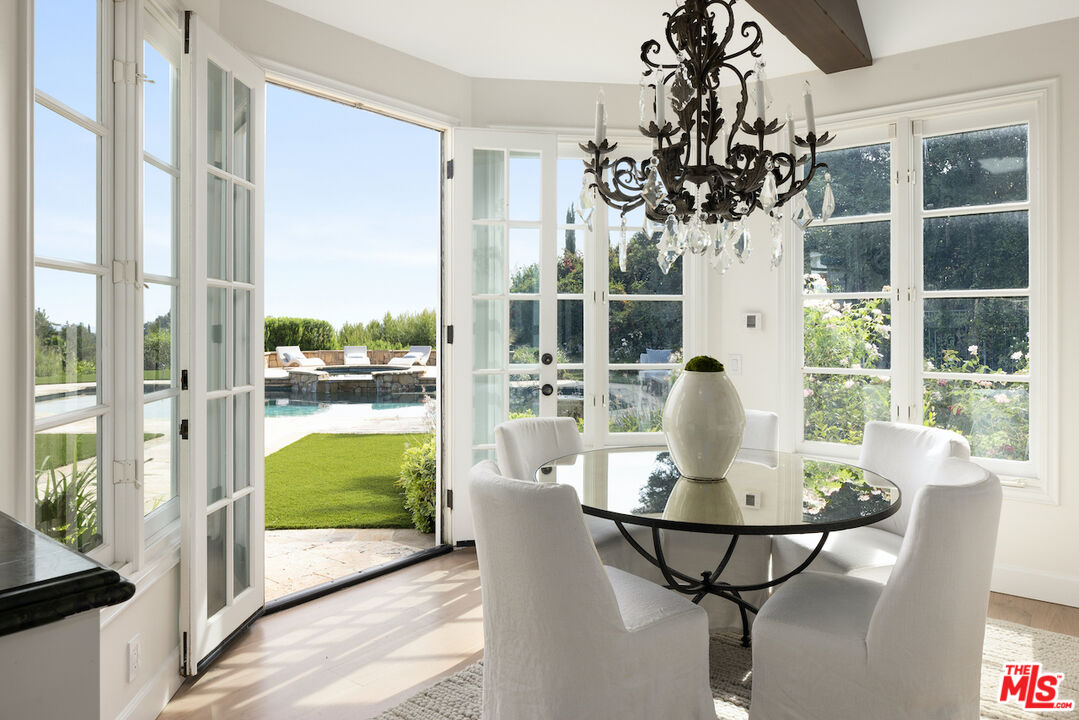 5933 Annie Oakley Road Hidden Hills, CA 91302 - Photo 12 of 22 a view of a dining room with furniture window and outside view