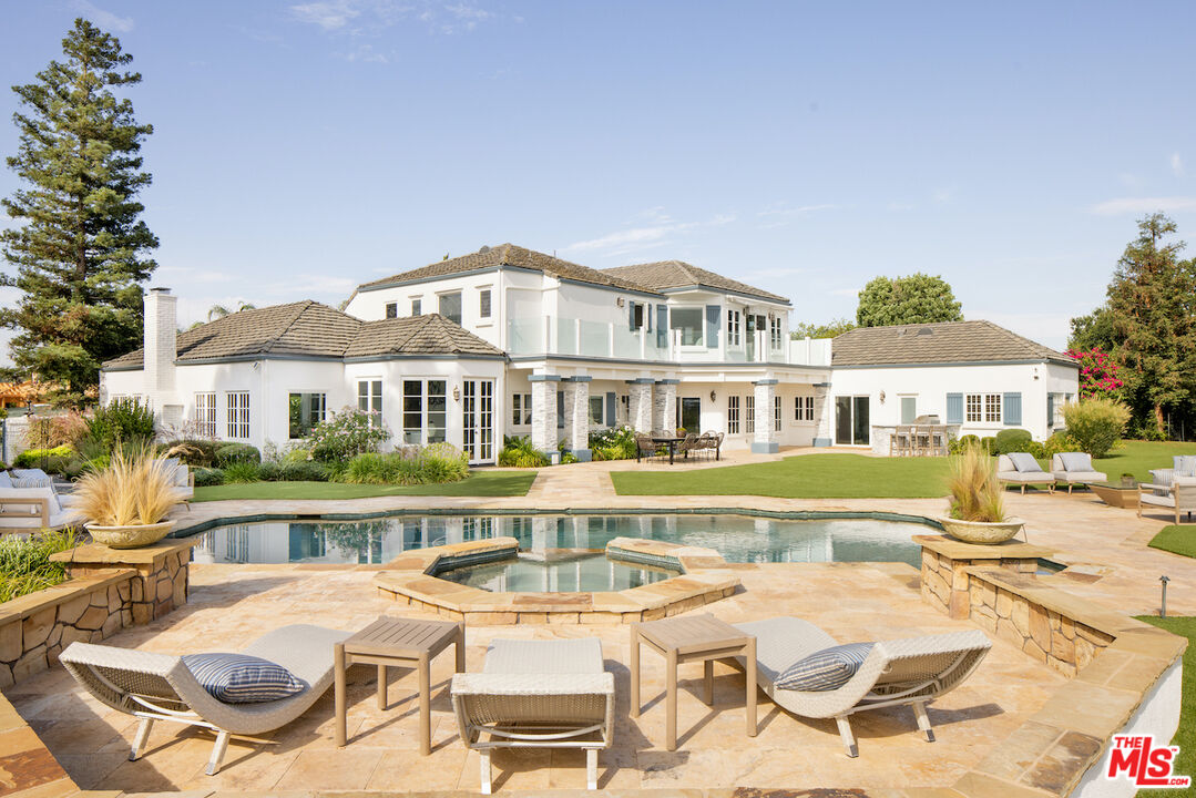 5933 Annie Oakley Road Hidden Hills, CA 91302 - Photo 13 of 22 a view of a house with swimming pool
