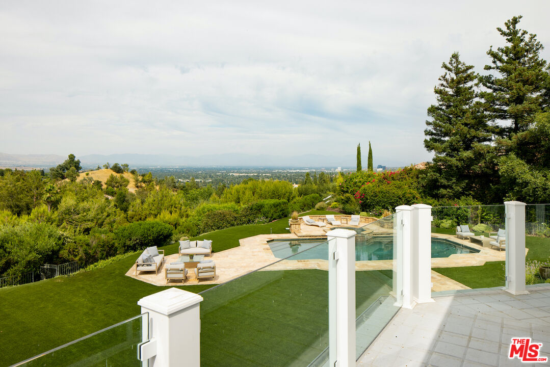 5933 Annie Oakley Road Hidden Hills, CA 91302 - Photo 18 of 22 a view of a terrace with chairs