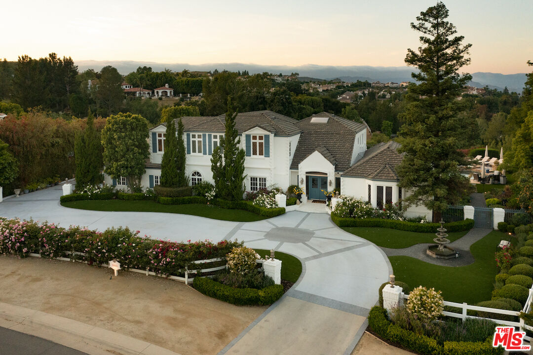 5933 Annie Oakley Road Hidden Hills, CA 91302 - Photo 2 of 22 an aerial view of a house with a garden