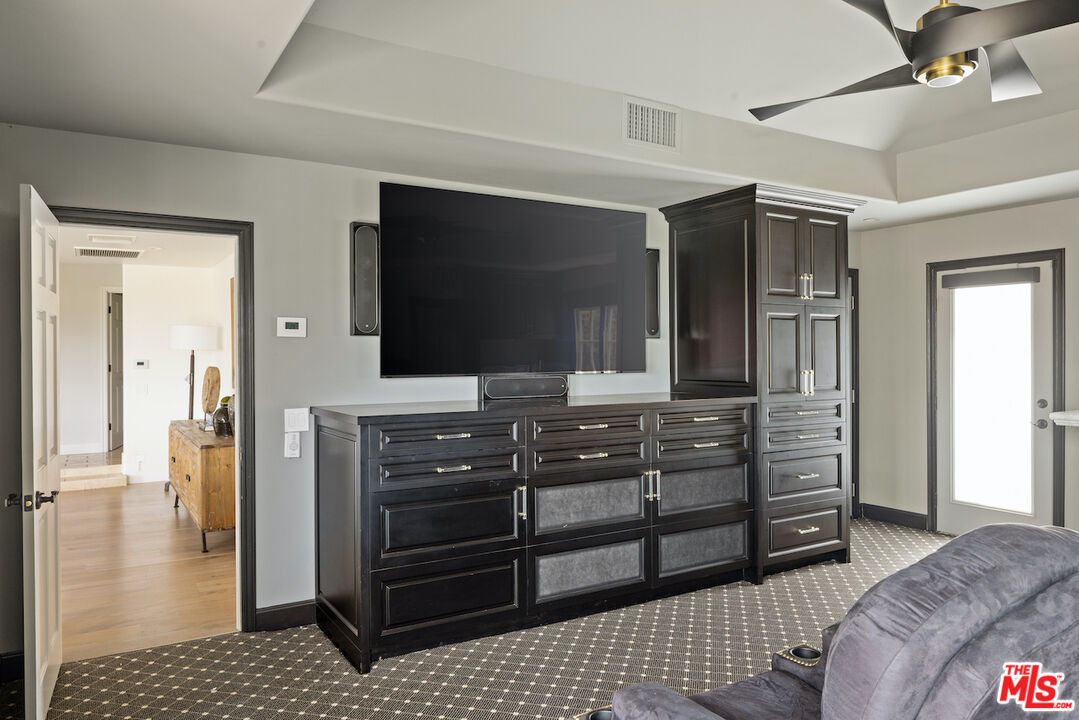 5933 Annie Oakley Road Hidden Hills, CA 91302 - Photo 21 of 22 a room with a bed and furniture