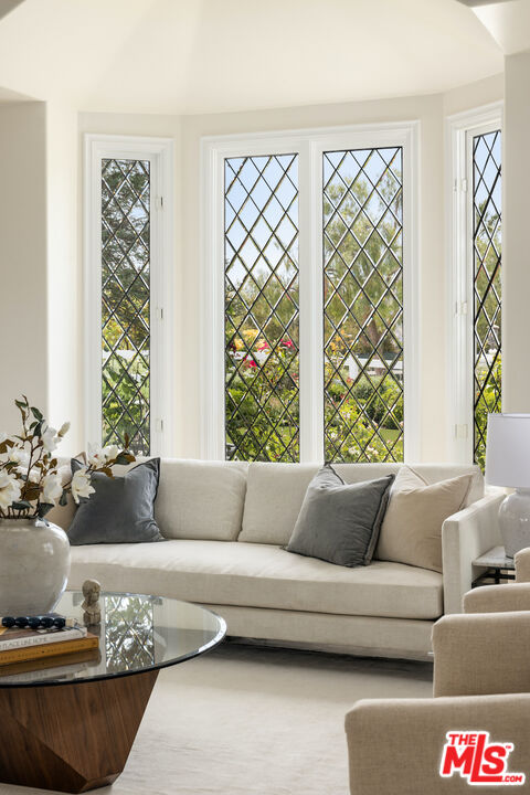 5933 Annie Oakley Road Hidden Hills, CA 91302 - Photo 6 of 22 a living room with furniture and a large window