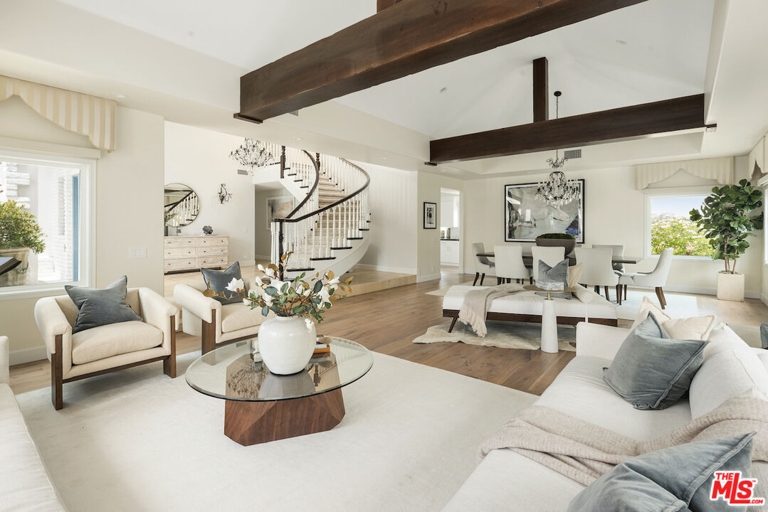 5933 Annie Oakley Road Hidden Hills, CA 91302 - Photo 7 of 22 a living room with furniture and white walls