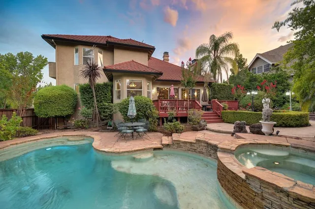 a view of a house with swimming pool