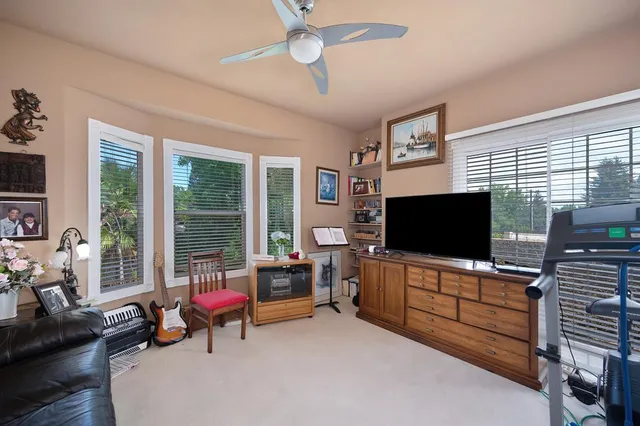a bathroom with a tub sink and large window