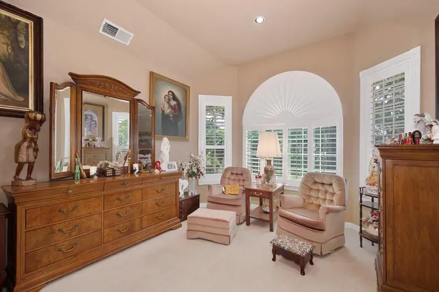 a swimming pool with outdoor seating and yard