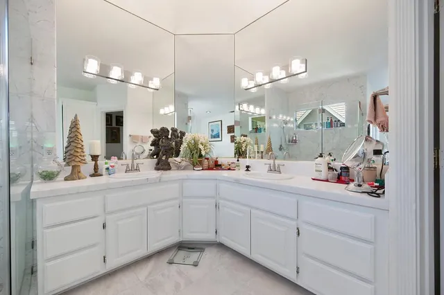 a view of a house with swimming pool and sitting area