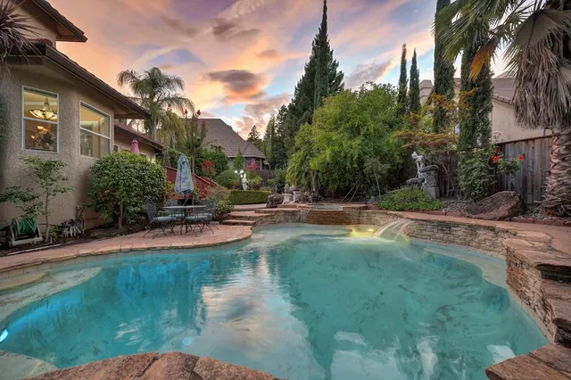 a view of a building with a yard and garage