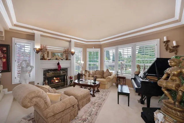 a view of a dining room with furniture wooden floor and chandelier