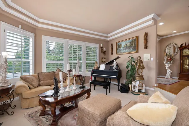 a room with lots of furniture and chandelier
