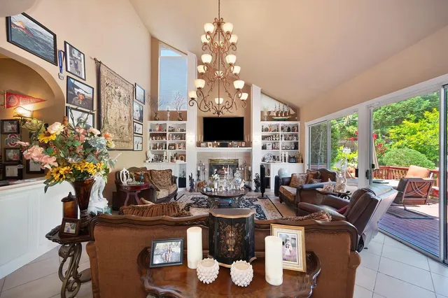 a large kitchen with sink a stove and wooden floor