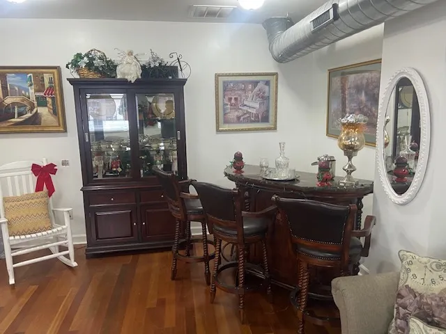 a view of a dining room with furniture and chandelier