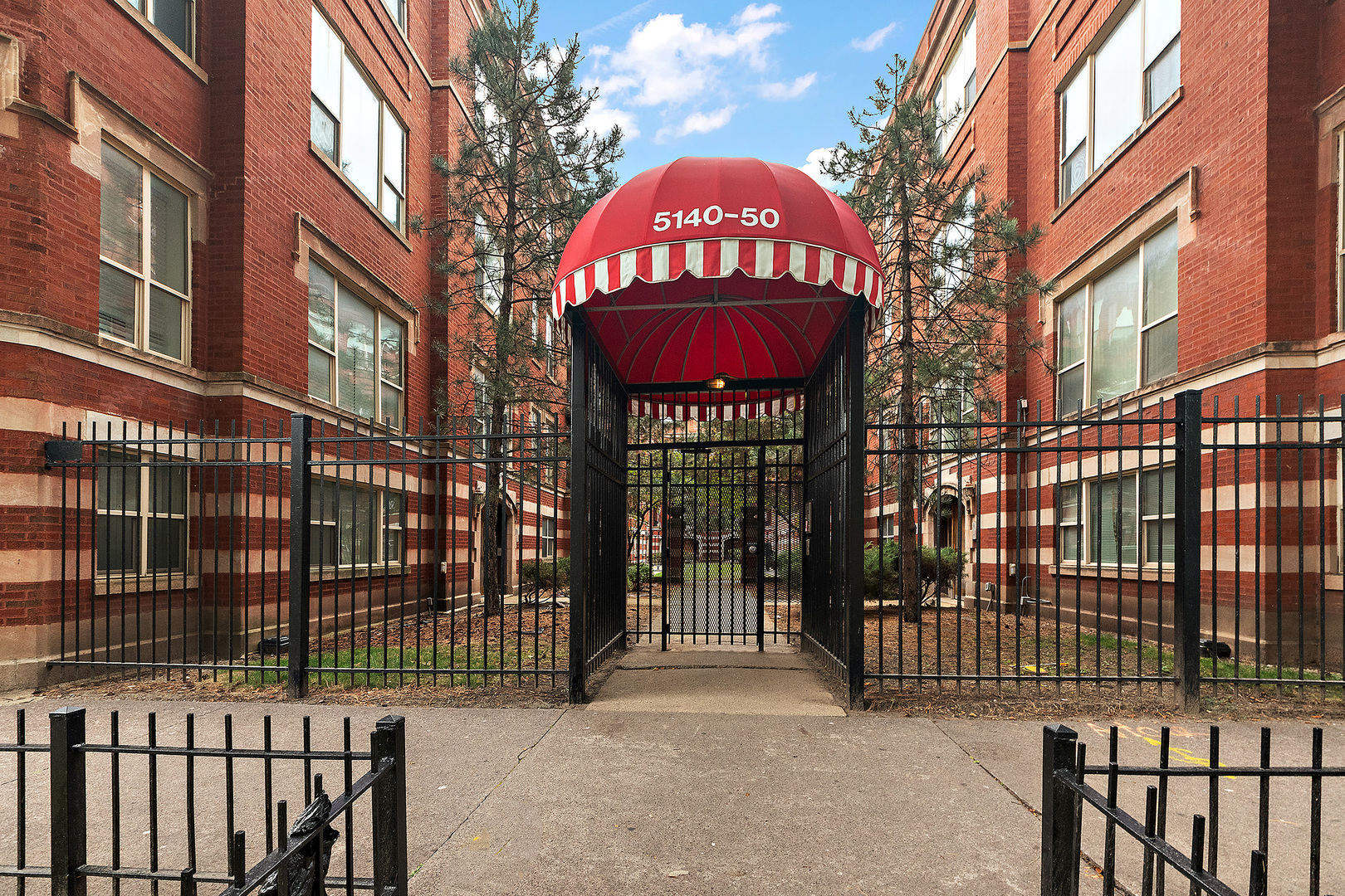 a view of a brick building with a red door