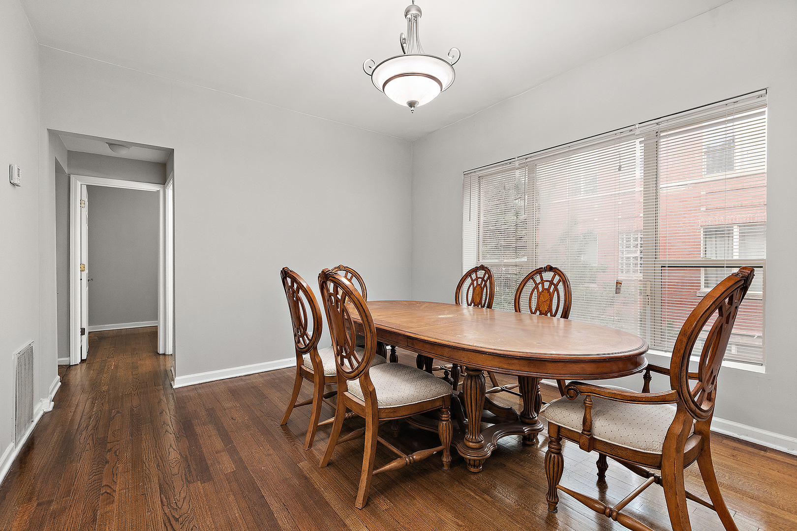 5150 South King Drive, Unit 2A Chicago, IL 60615 - Photo 11 of 22 a view of a dining room with furniture and wooden floor