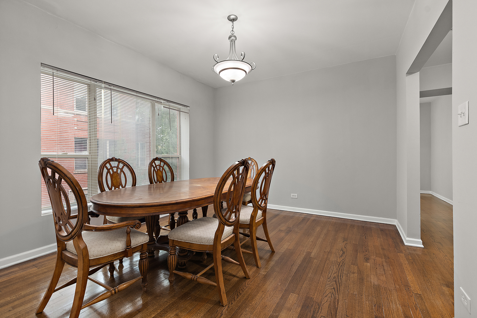 5150 South King Drive, Unit 2A Chicago, IL 60615 - Photo 12 of 22 a view of a dining room with furniture window and wooden floor