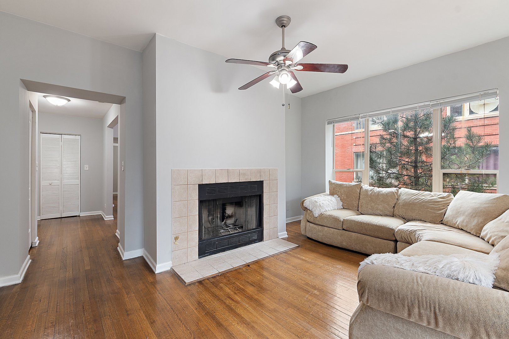 5150 South King Drive, Unit 2A Chicago, IL 60615 - Photo 7 of 22 a living room with furniture and a fireplace