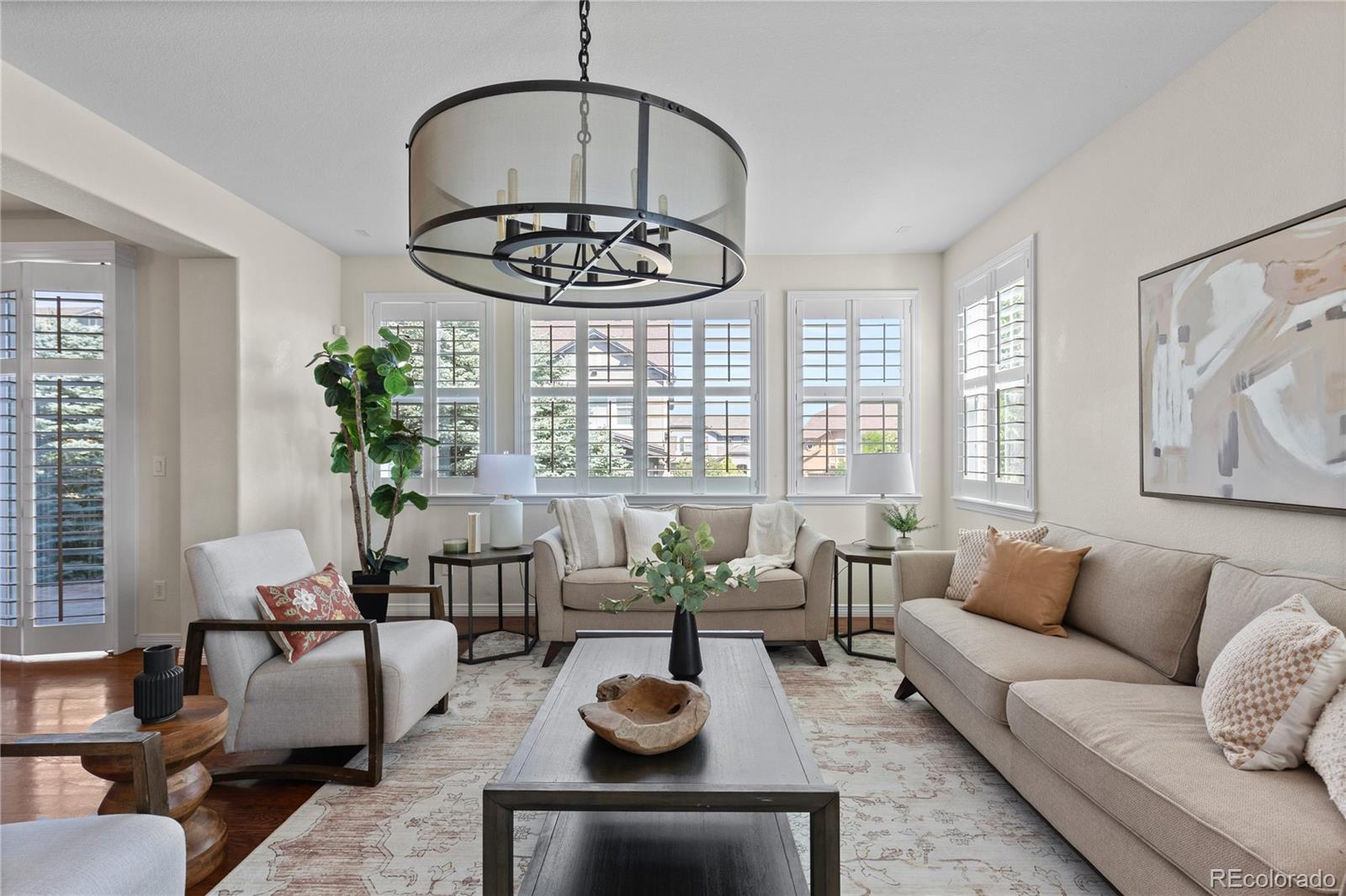 10840 Valleybrook Circle Highlands Ranch, CO 80130 - Photo 18 of 49 a living room with furniture and a large window