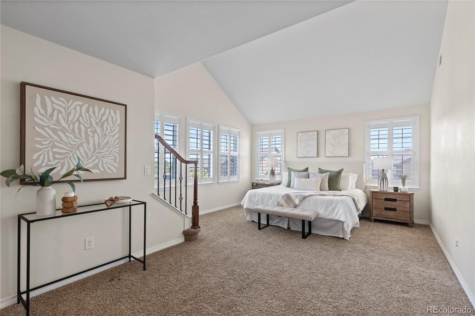 10840 Valleybrook Circle Highlands Ranch, CO 80130 - Photo 26 of 49 a bed room with a bed and a chandelier