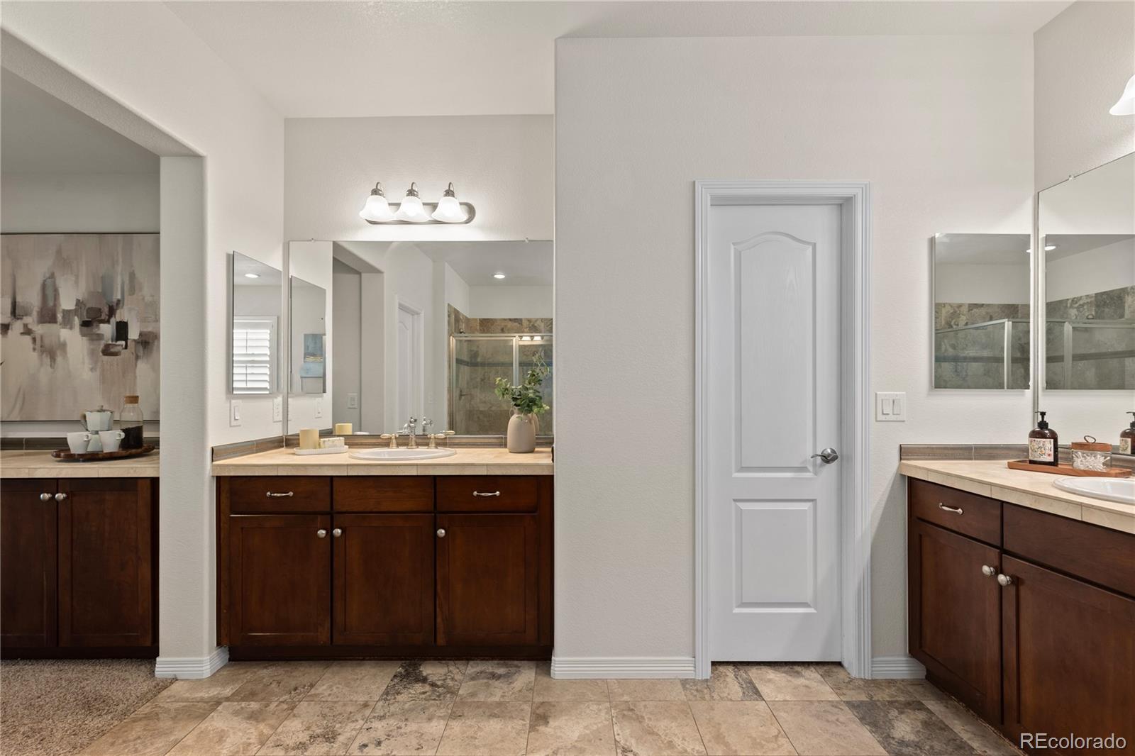 10840 Valleybrook Circle Highlands Ranch, CO 80130 - Photo 36 of 49 a bathroom with a sink and a mirror