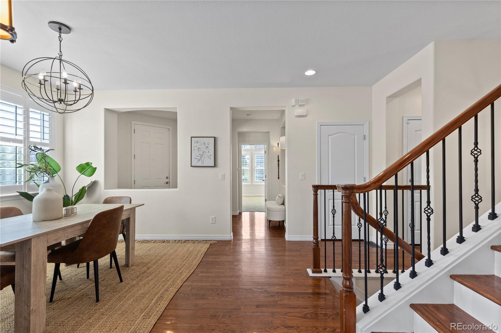 10840 Valleybrook Circle Highlands Ranch, CO 80130 - Photo 10 of 49 a view of dining room with wooden floor and furniture