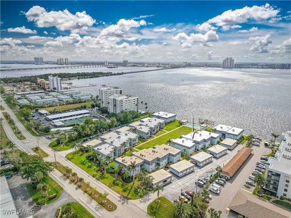 a view of a lake with a building in the background