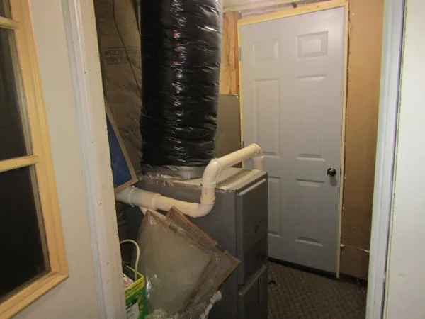 a kitchen with a refrigerator and a sink