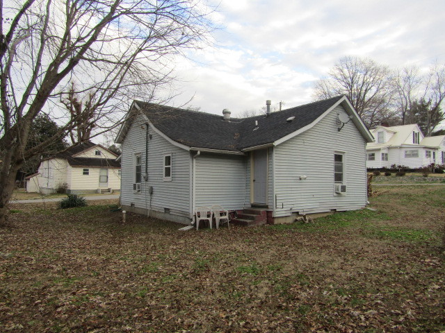 285 East School Street Cave In Rock, IL 62919 - Photo 3 of 20 a view of a house with a yard and a large tree