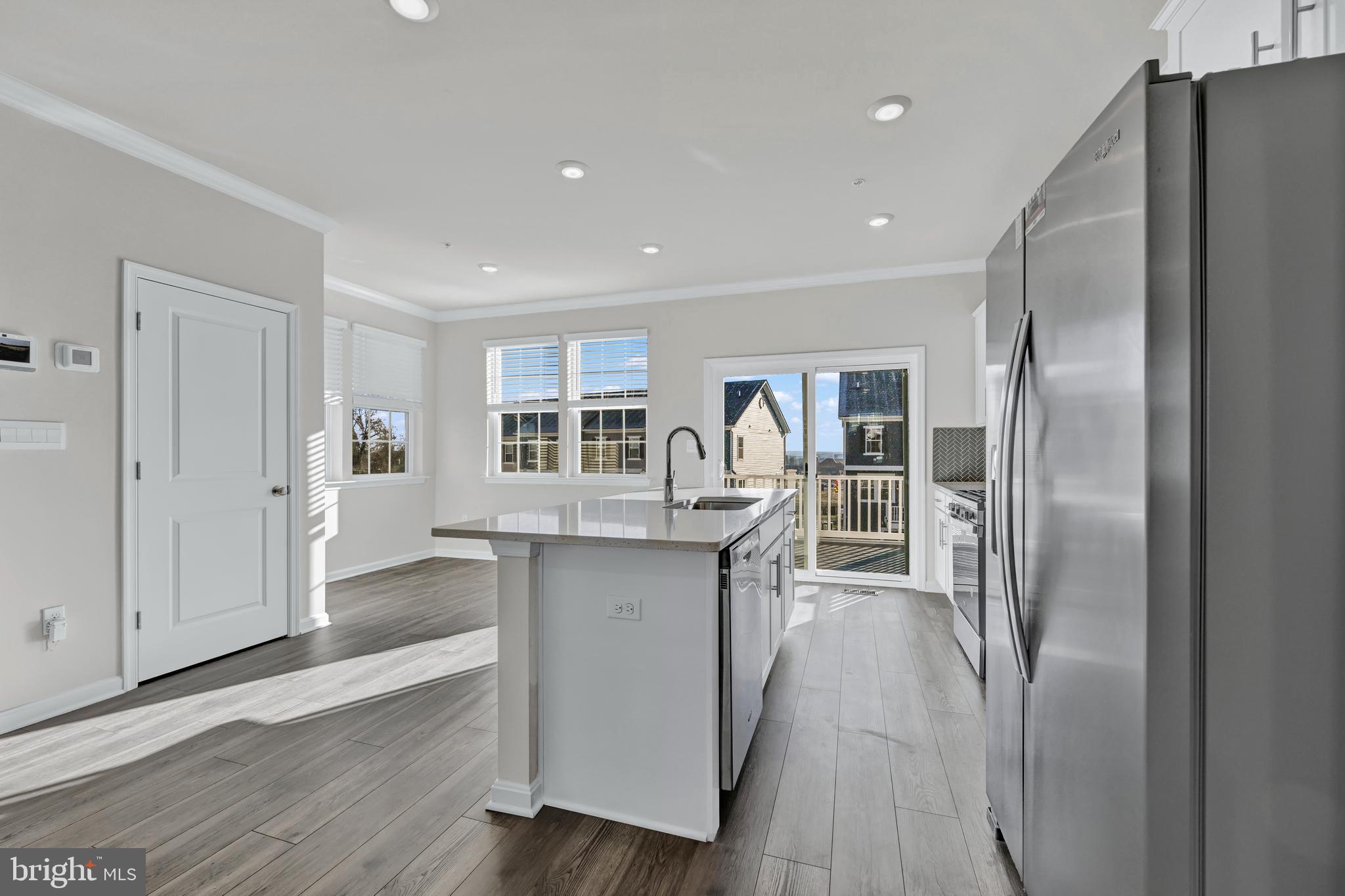 5015 Silver Oak Drive Rosedale, MD 21237 - Photo 11 of 34 a kitchen with stainless steel appliances granite countertop a refrigerator and a sink