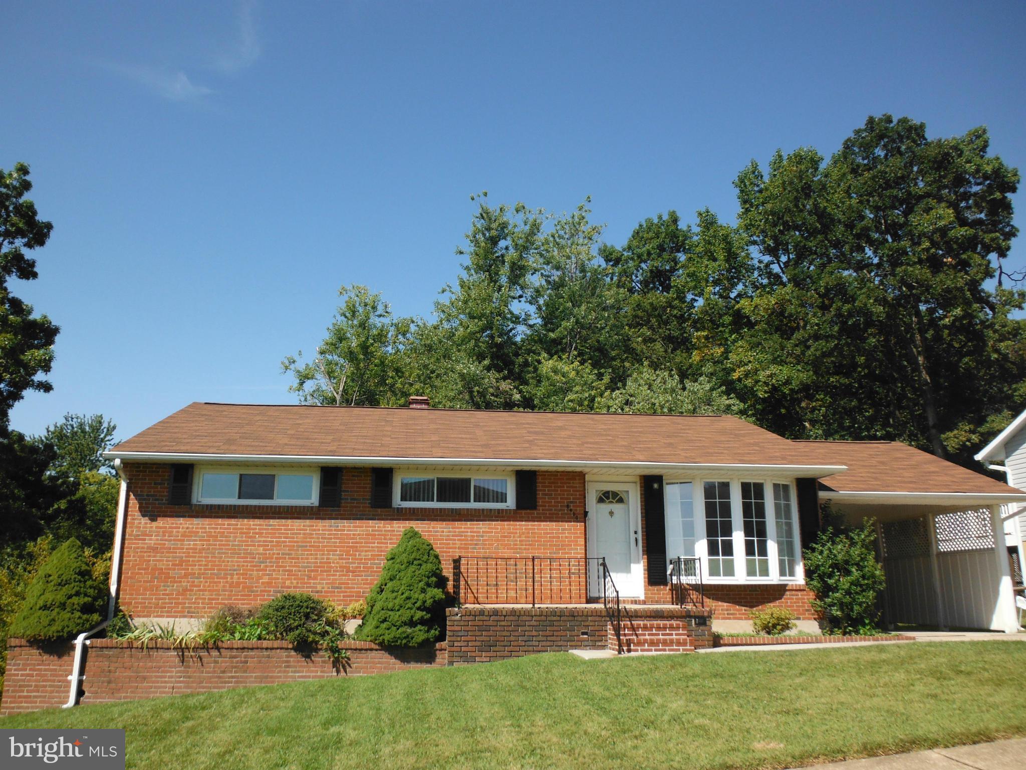 8400 Allison Lane Rosedale, MD 21237 - Photo 1 of 23 a front view of a house with a yard
